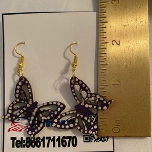 Butterfly handmade leather earrings.